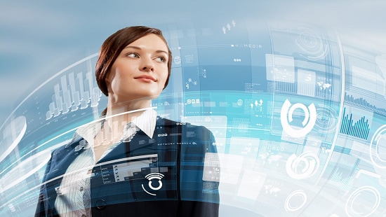 Woman standing in front of digital charts