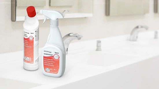 Keystone Toilet & Sanitary Spray say on a washroom surface next to a sink